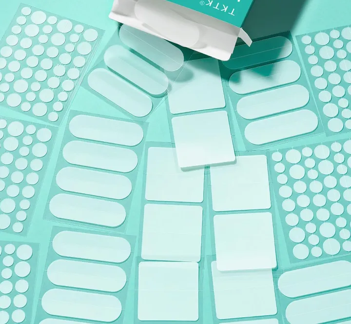 TKTK patches: flat lay of sheets spilling from the box