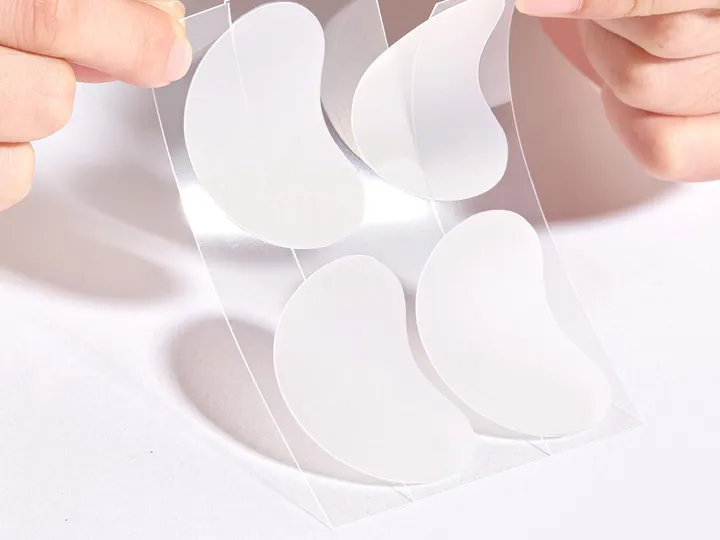 TKTK patches: hand peeling a moon-shaped patch